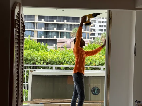 Brigadoon Renovation — Setting the new balcony door frame