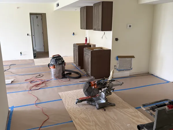 Brigadoon Renovation — Cabinet install with floors protected