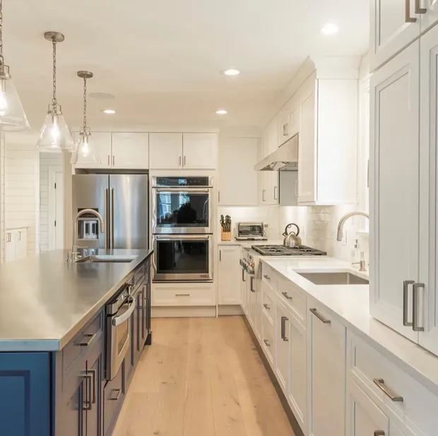 Custom kitchen renovation with a navy blue island