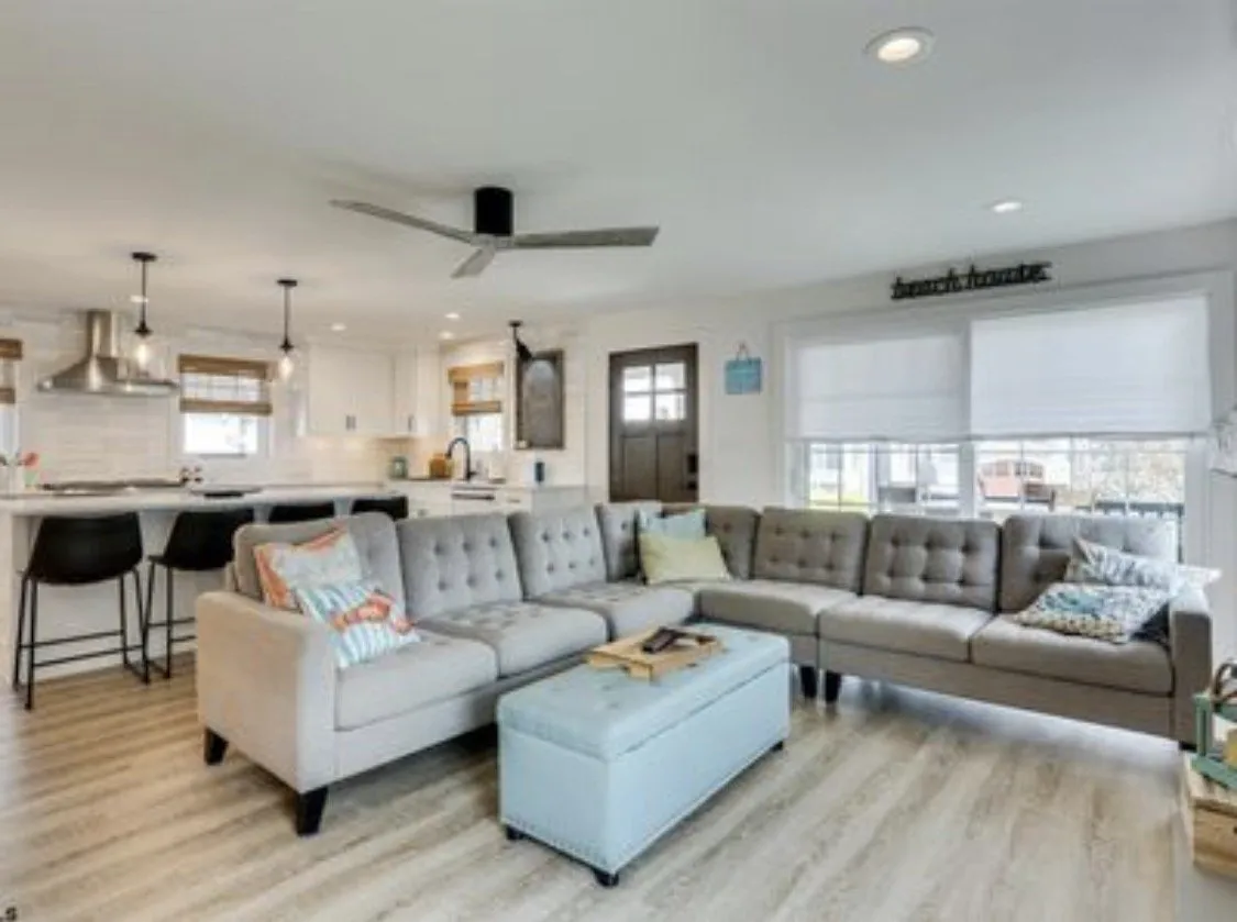 Open-plan kitchen with a quartz island in a Seaboard Builders custom home