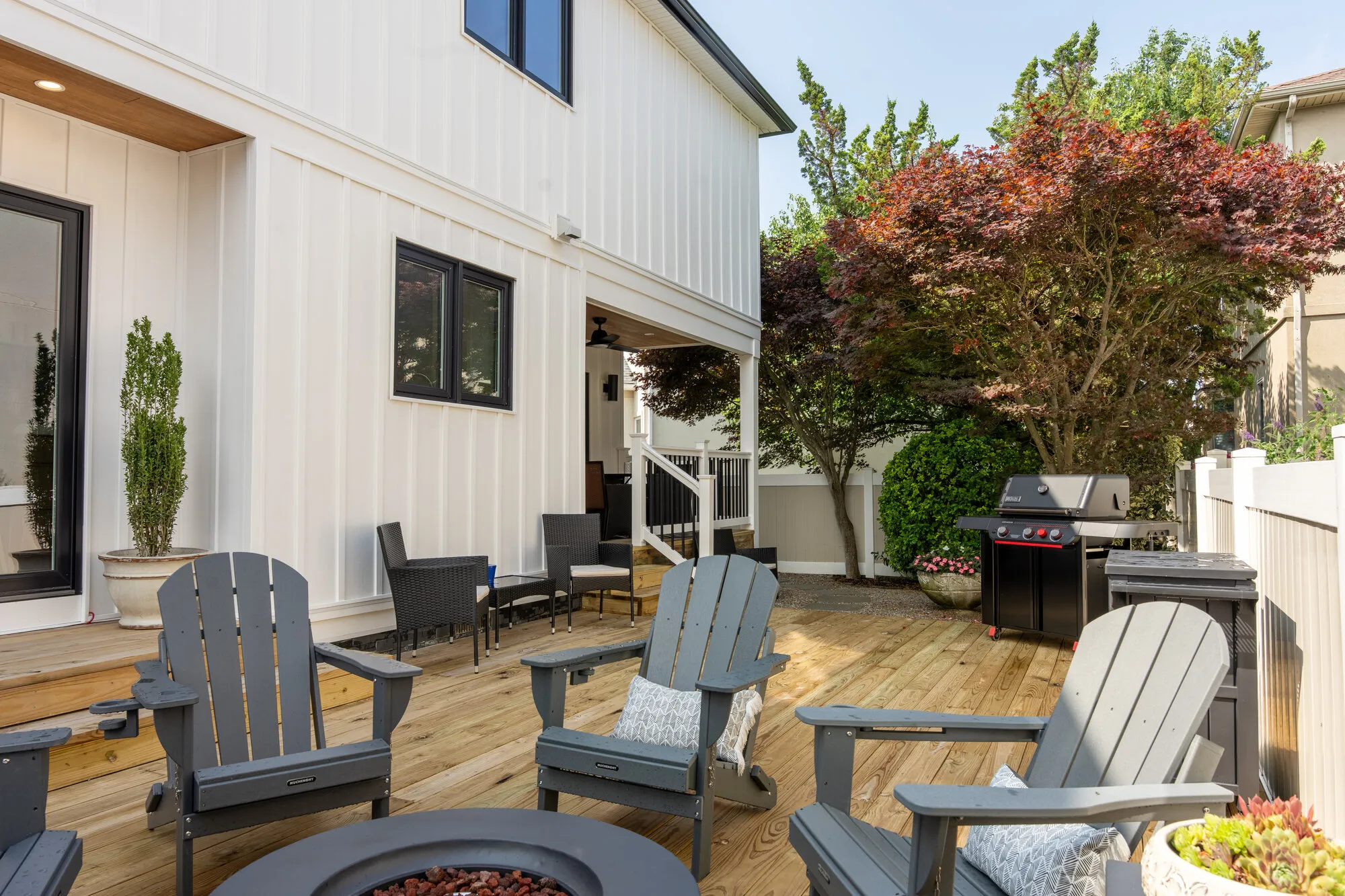 Rear deck with fire pit seating, the outdoor living Seaboard builds on Singer Island oceanfront lots